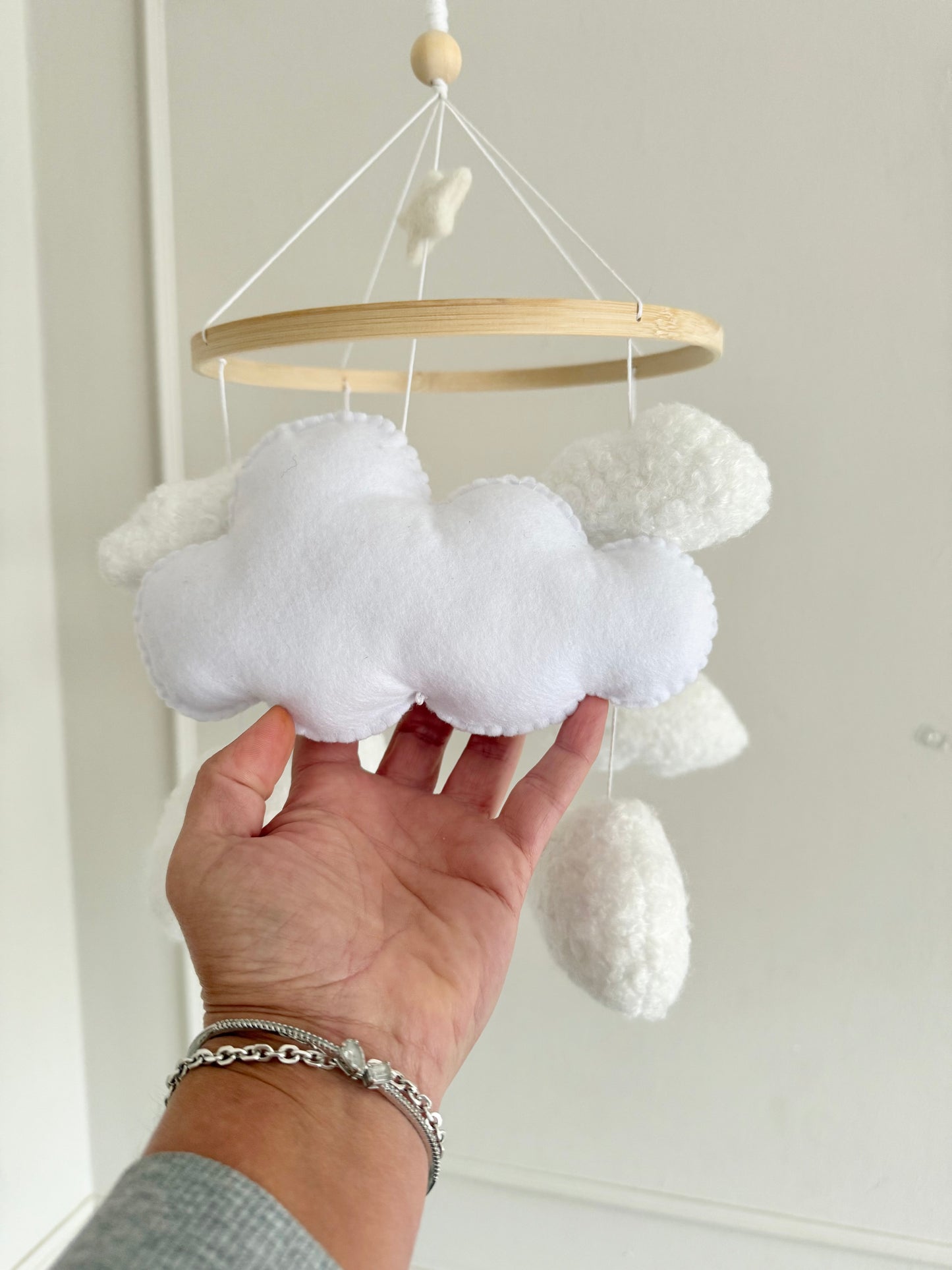 CLOUD NINE cot mobile for a neutral nursery. Handcrafted with 8 boucle clouds and 1 felt large cloud.