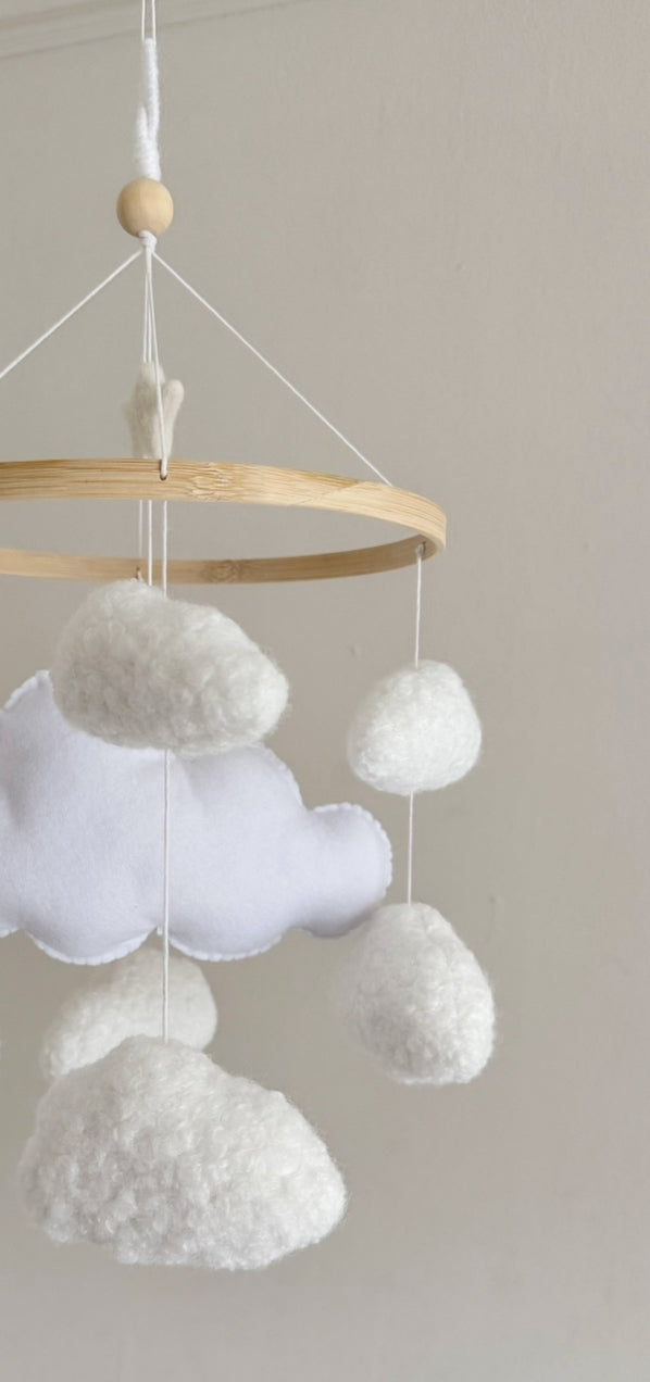 CLOUD NINE cot mobile for a neutral nursery. Handcrafted with 8 boucle clouds and 1 felt large cloud.
