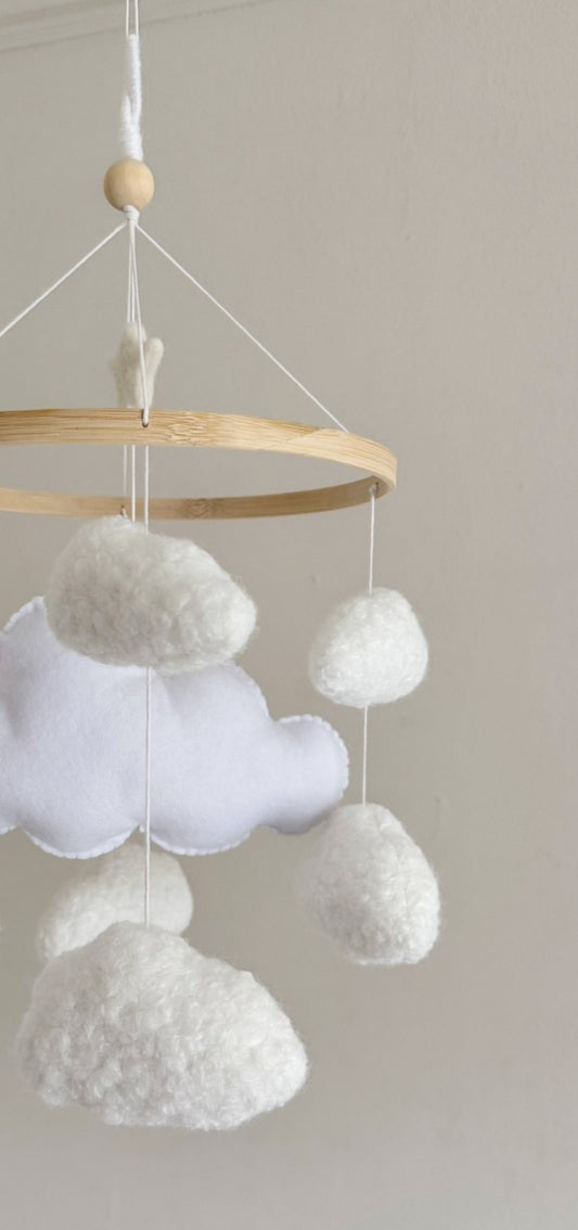 CLOUD NINE cot mobile for a neutral nursery. Handcrafted with 8 boucle clouds and 1 felt large cloud.