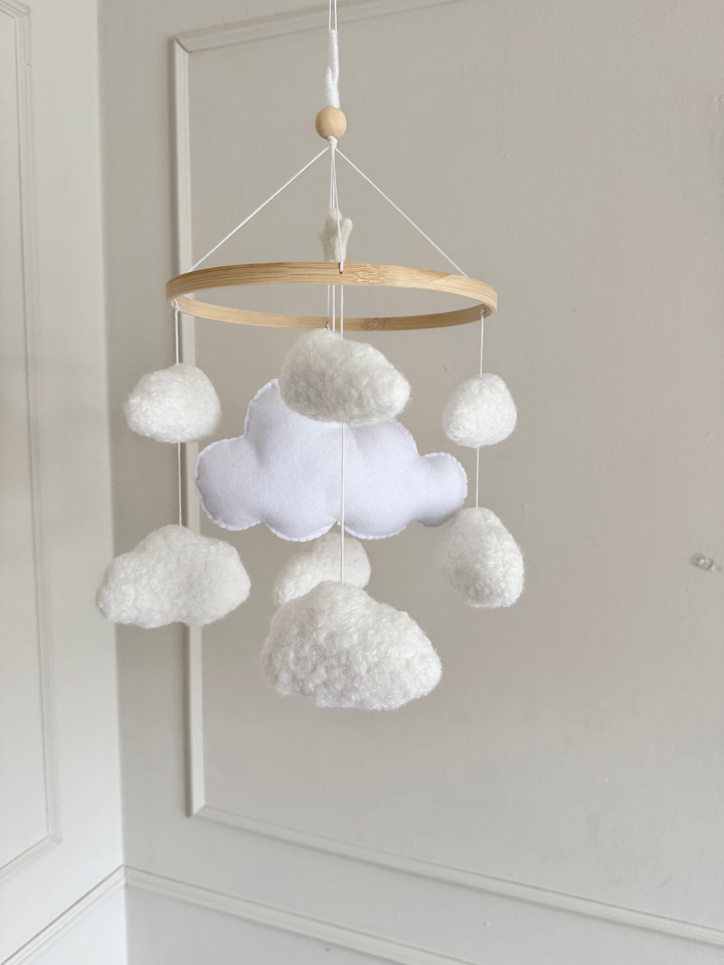 CLOUD NINE cot mobile for a neutral nursery. Handcrafted with 8 boucle clouds and 1 felt large cloud.